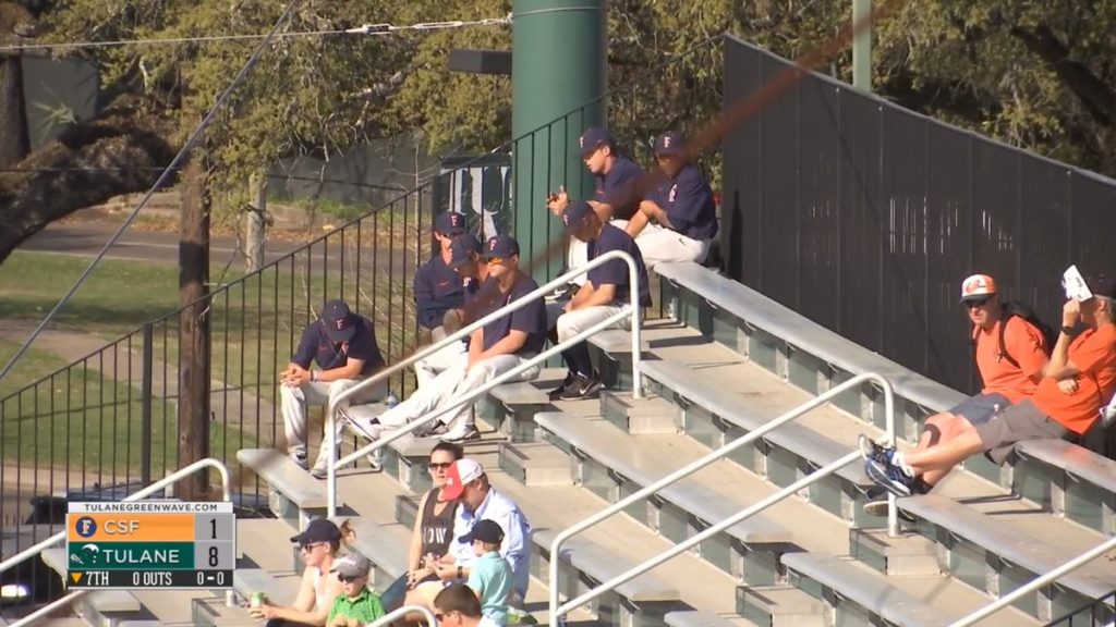 Seven Titan Baseball players sit in the 1st base bleachers after being suspended for Sunday's game for missing curfew.