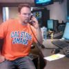 Jim Rome Show Producer Jason Stewart wears his Cal State Omaha shirt on casual Friday